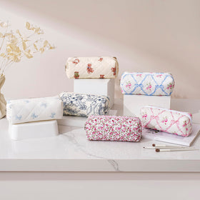 HHQQWZ Makeup Bag displayed with cosmetics inside