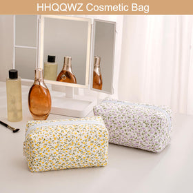 HHQQWZ Makeup Bag in a travel setting with suitcase