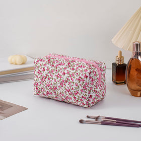 HHQQWZ Makeup Bag lifestyle image with beauty products inside