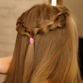 Hicarer Mini Rubber Hair Bands in a hand for portability