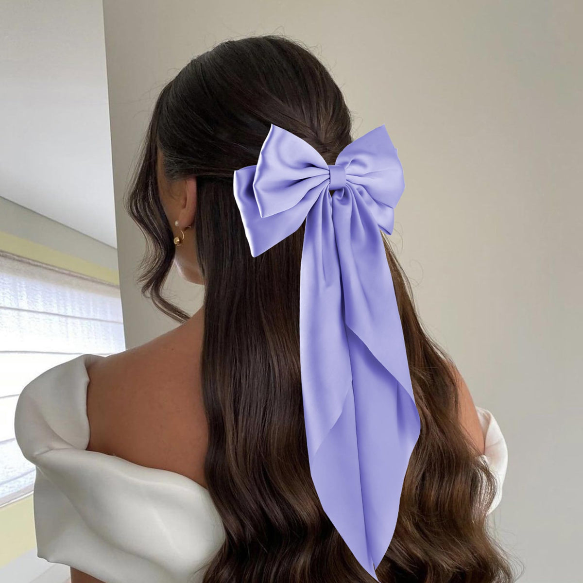 hisial large bow hair clip in deep blue on a model