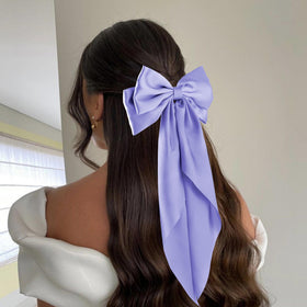 hisial large bow hair clip in deep blue on a model