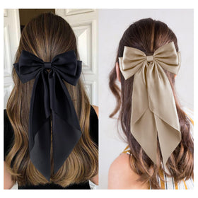 hisial large bow hair clip in light pink on a model