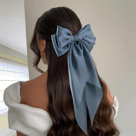 hisial large bow hair clip in use on a ponytail