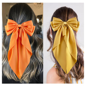 hisial large bow hair clip in white, on a hairstyle