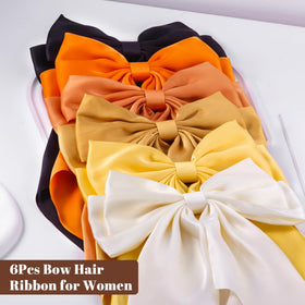 hisial large bow hair clips displayed on a table