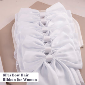 hisial Large Bow Hair Clips on a calendar and bag