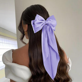 hisial Large Bow Hair Clips purple on a model's hair