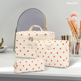 honitty Floral Makeup Bag Set in a suitcase