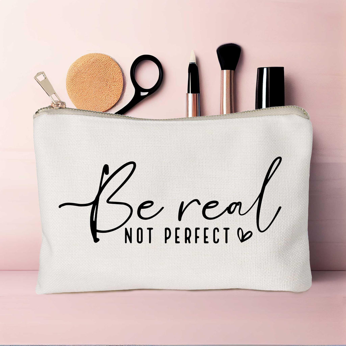 HubbgDesign makeup bag alongside makeup products on table