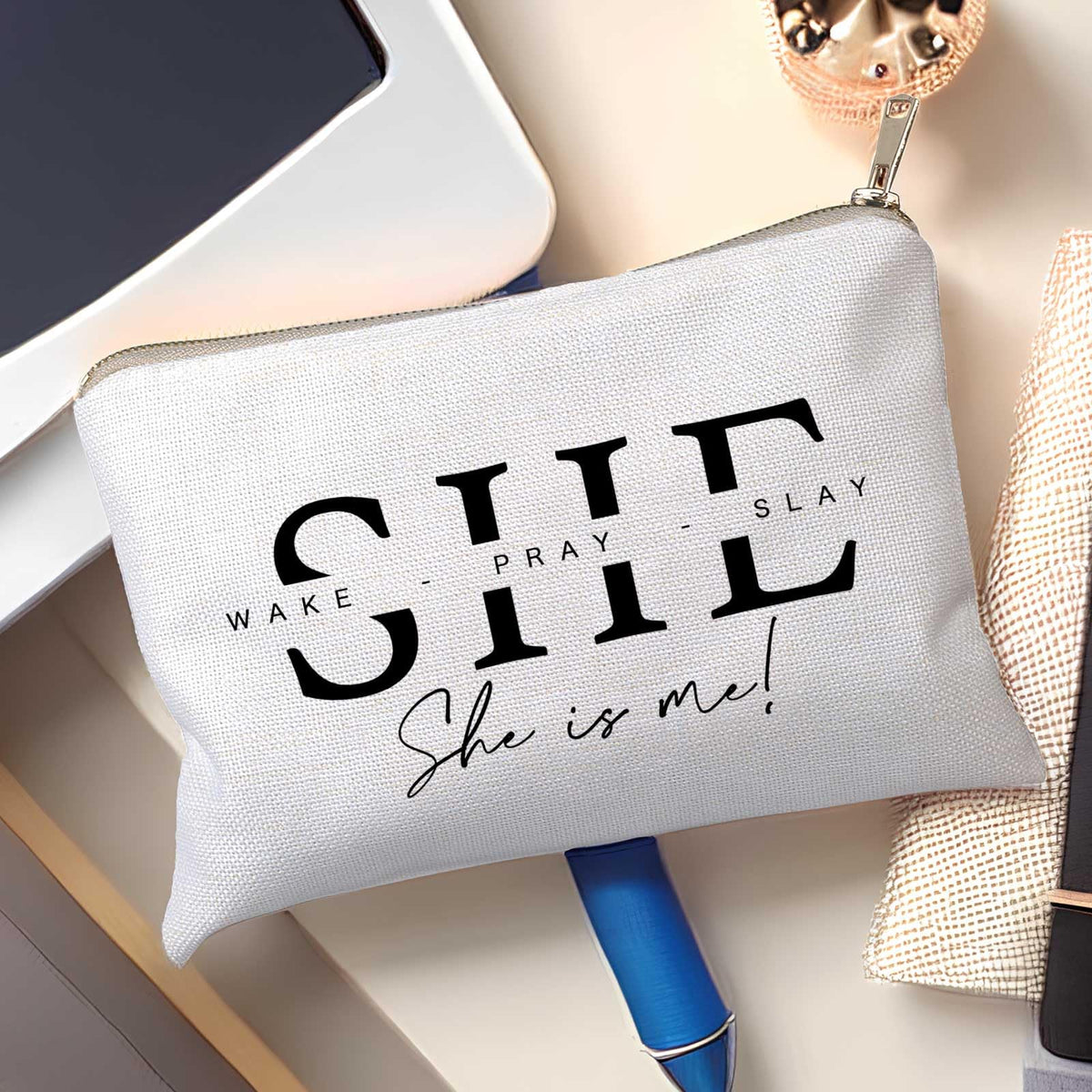 HubbgDesign She Wake Pray Slay Makeup Bag with makeup items inside