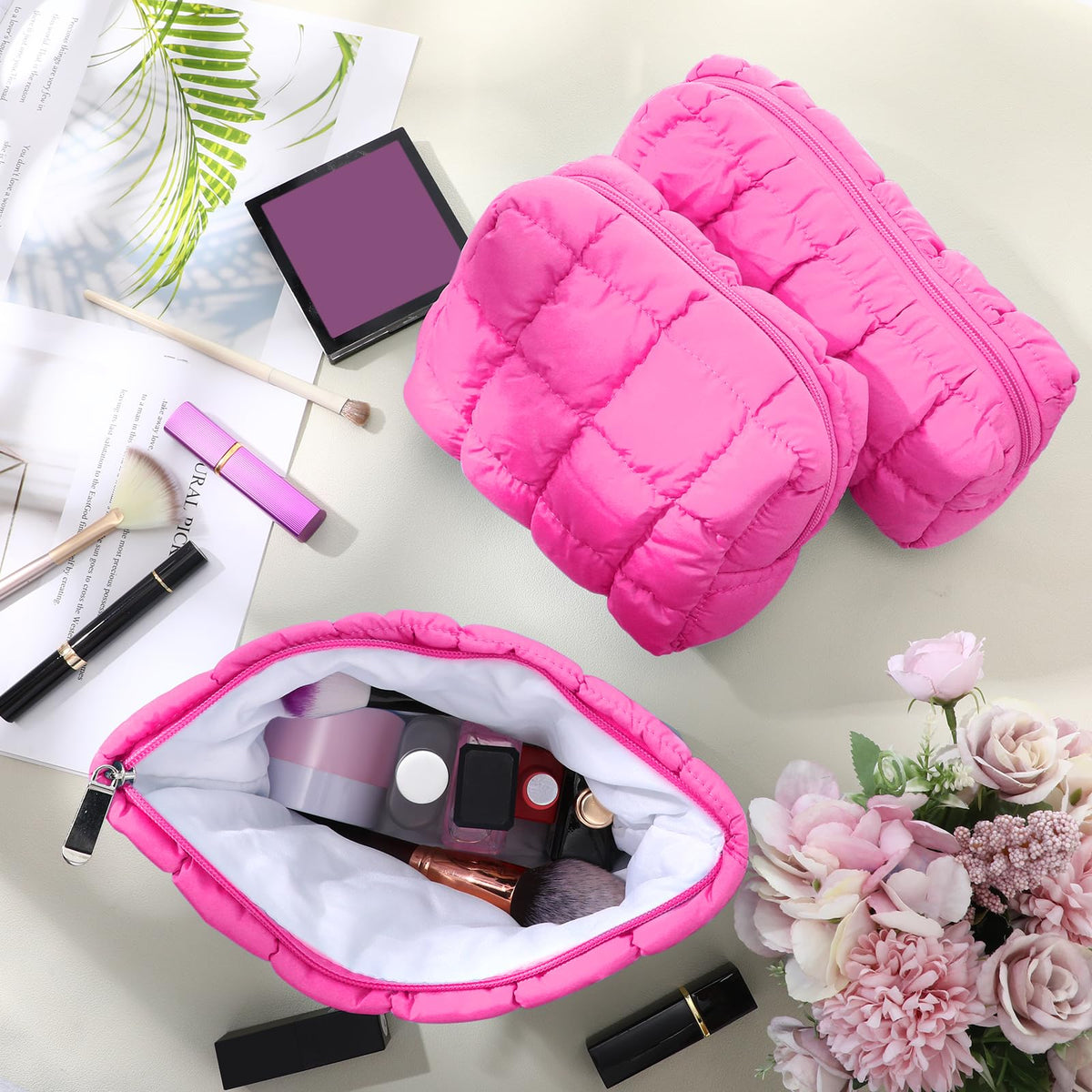 Huhumy quilted makeup bags stacked together in hot pink
