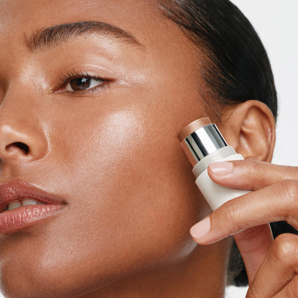 ILIA Multi-Stick Cheek + Lip Color In The City Bronze Pearl applied on lips