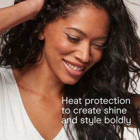 INFINITIPRO BY CONAIR Curling Wand with user styling hair