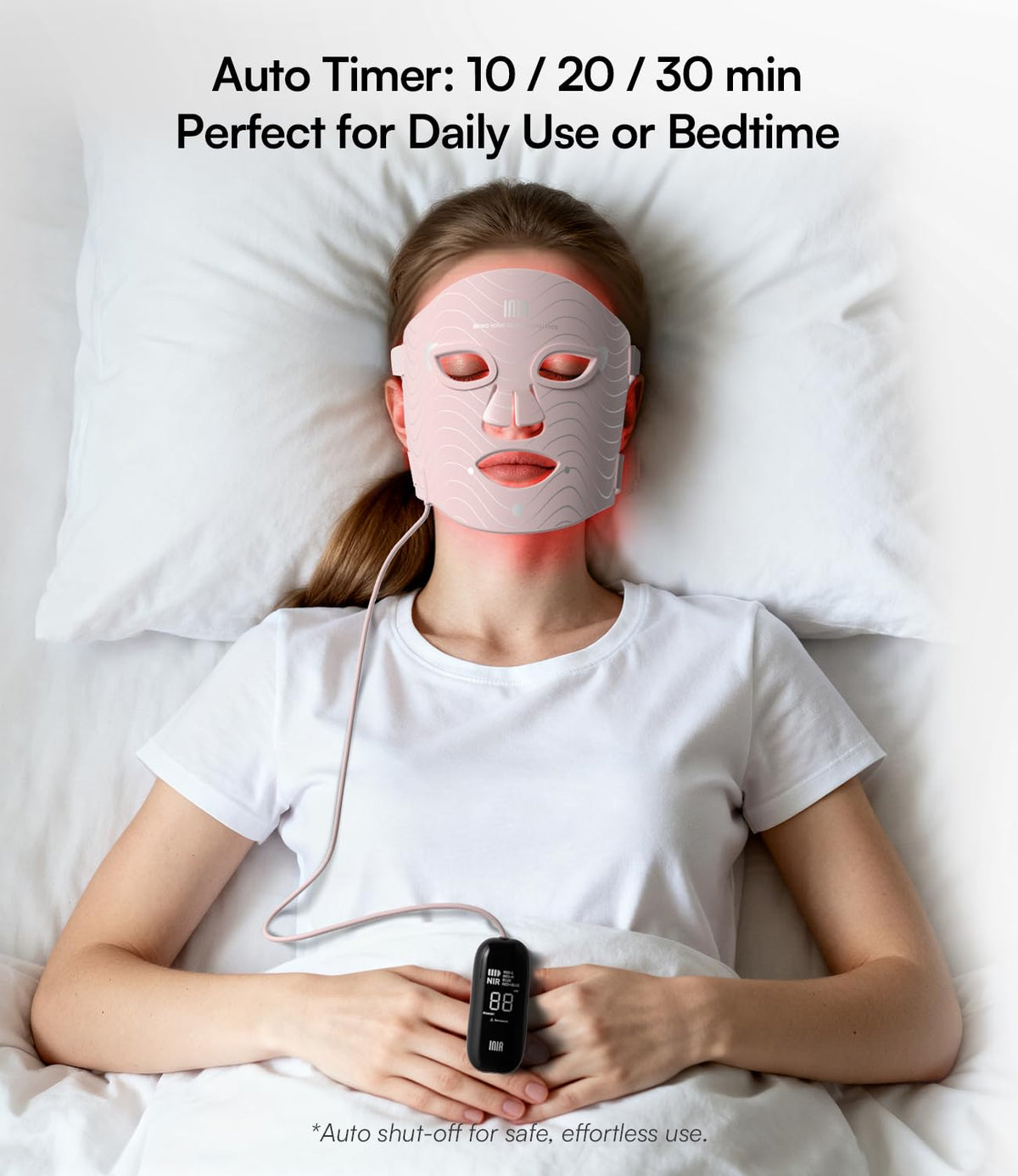 INIA Red Light Therapy Mask with timer controller in hand