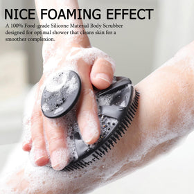 INNERNEED silicone body scrubber showing size comparison in hand