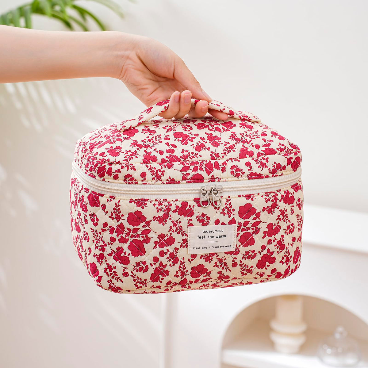 Inside of uekeboag Large Travel Quilted Makeup Bag with cosmetics arranged
