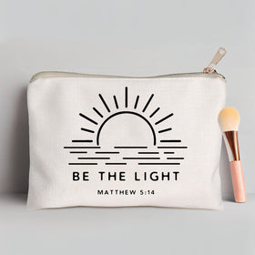 Inside view of HubbgDesign Be The Light makeup bag showing storage space