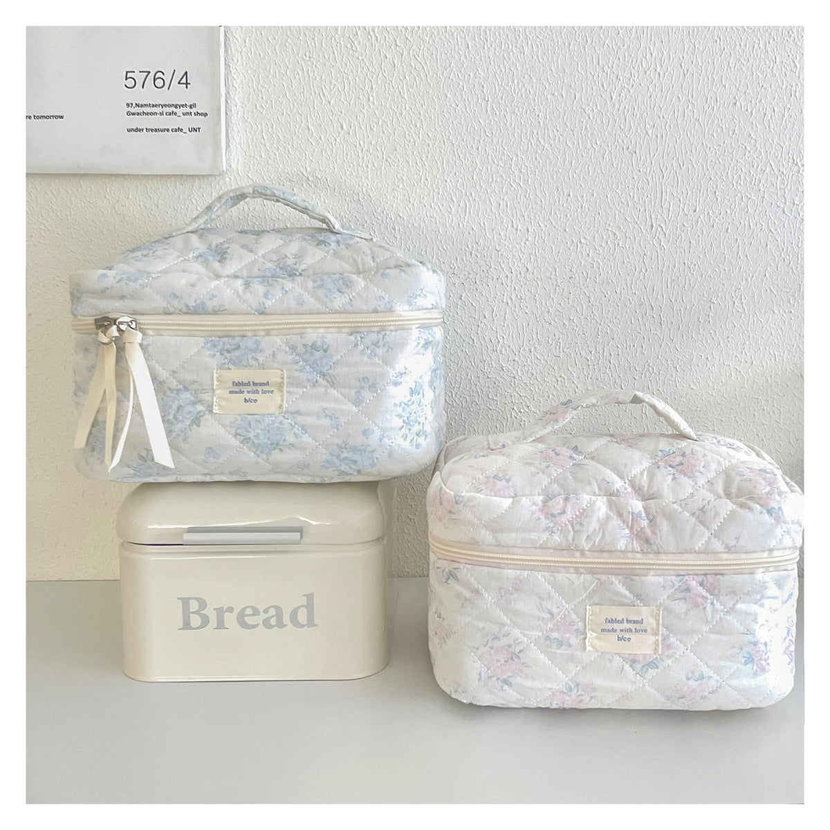 Inside view of uekeboag Quilted Makeup Bag showing storage compartments