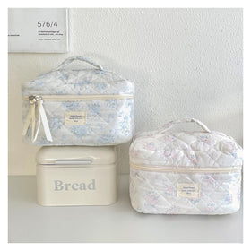 Inside view of uekeboag Quilted Makeup Bag showing storage compartments