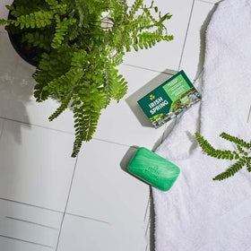 Irish Spring Deodorant Bar Soap Original with a towel and water