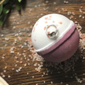 Jackpot Candles Bath Bomb in a bathtub with bubbles