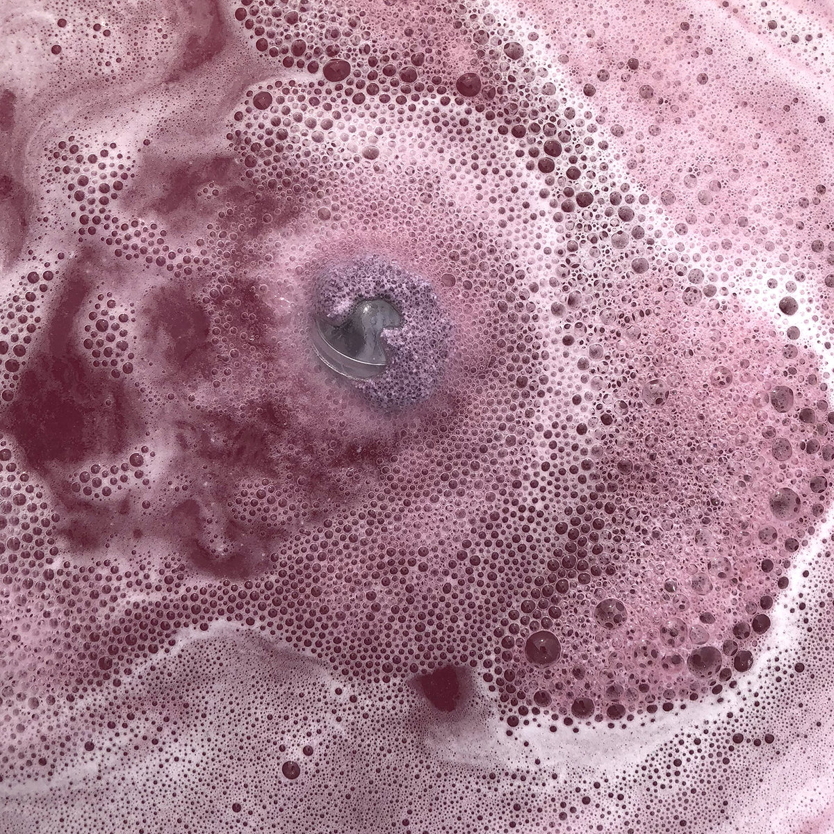 Jackpot Candles Bath Bomb showing size comparison with standard bath bombs