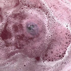 Jackpot Candles Bath Bomb showing size comparison with standard bath bombs
