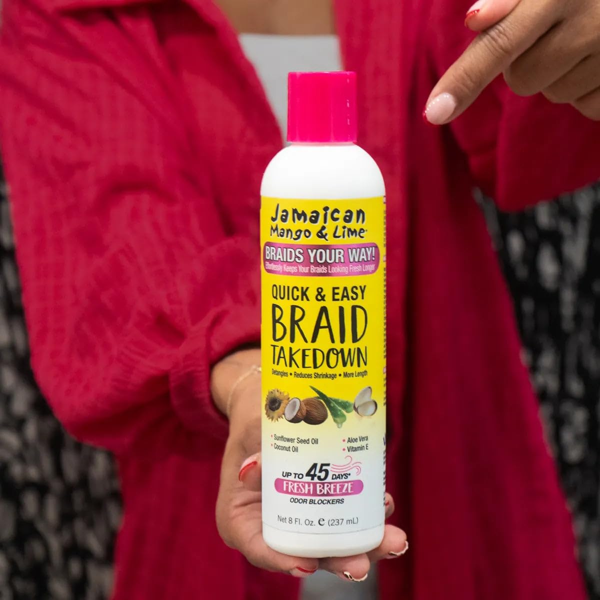Jamaican Mango & Lime Braid Takedown Lotion 249g in use on braids