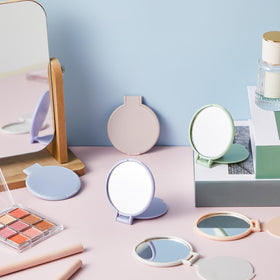 Jetec compact mirrors displayed in a cosmetic bag