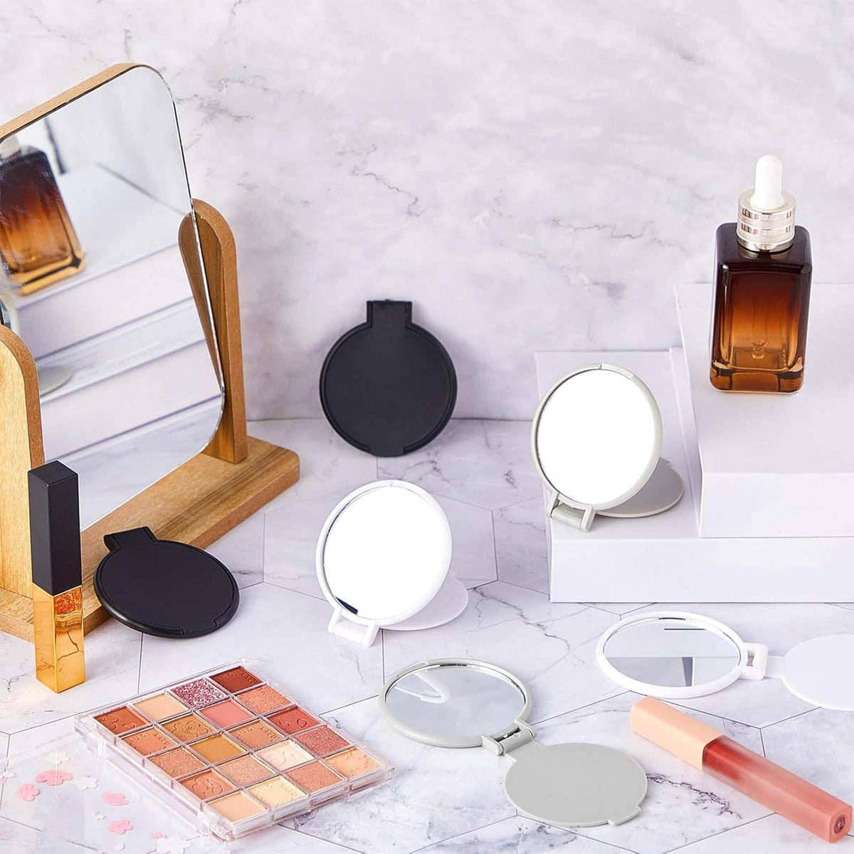 Jetec compact mirrors stacked in a cosmetic bag