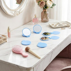 Jetec compact mirrors stacked in a purse