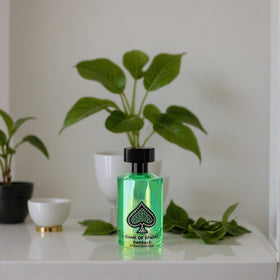 Jo Milano Paris Game of Spades EMERALD Eau de Parfum spray in lifestyle setting