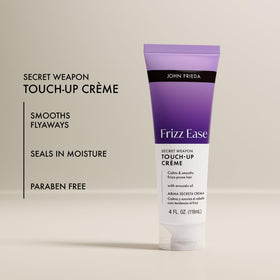 John Frieda Frizz Ease Smoothing Hair Creme on a bathroom counter