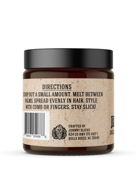 Johnny Slicks Pomade lid close-up with rugged scent description