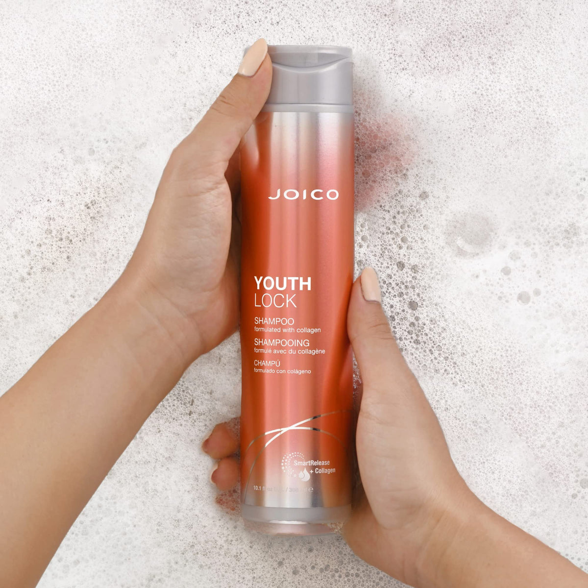 Joico YouthLock Shampoo with conditioner in background