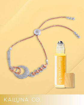 Kailuna Co. Honeysuckle Essential Oil Perfume Roll On on a wooden table