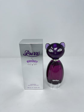 Katy Perry Purr Eau De Parfum Spray 3.4 oz with floral background