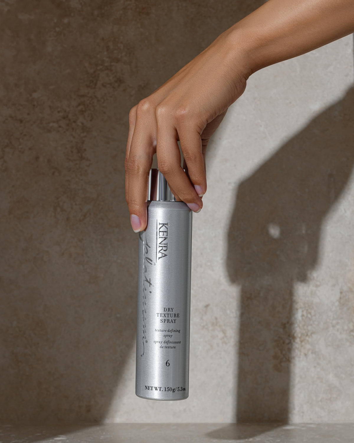 Kenra Platinum Dry Texture Spray in a bathroom setting