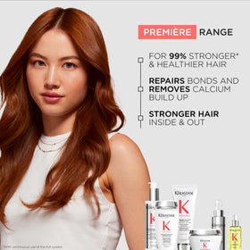 KÉRASTASE Premiere Shampoo on a wooden surface