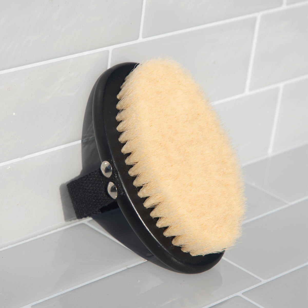 Kitsch Dry Brushing Body Brush with a backdrop of spa accessories