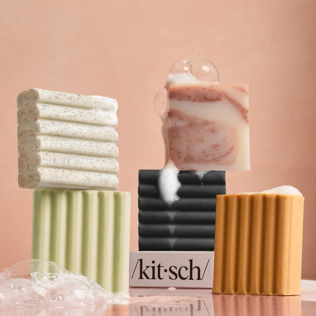 Kitsch Glycolic Acid Face & Body Wash Bar on a bathroom counter