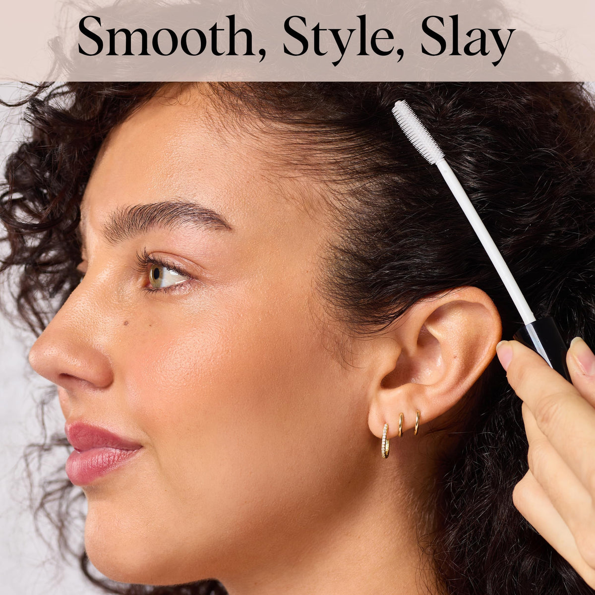 Kitsch Hair Taming Wand being applied to hair