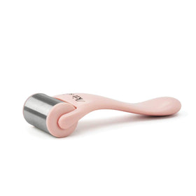 Kitsch Ice Roller for Face in use on a woman's cheek