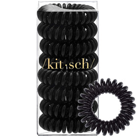 Kitsch Spiral Hair Ties with a background of hair care products