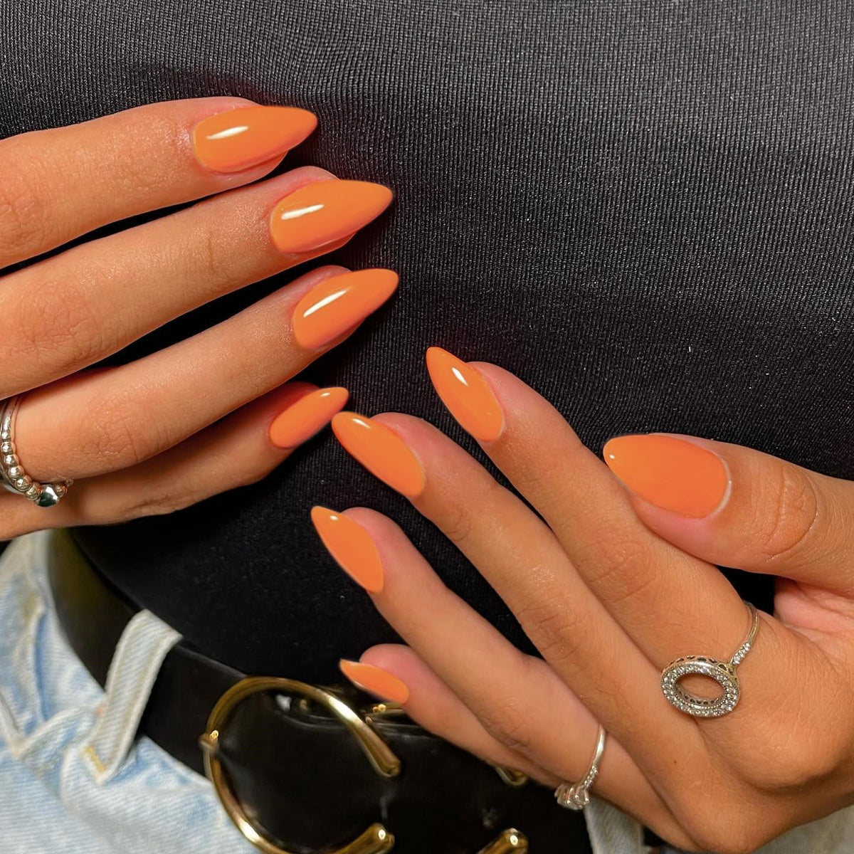 KQueenest reusable orange nails displayed on a hand