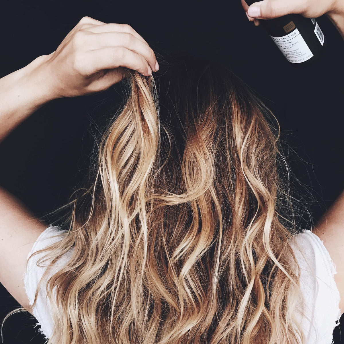 Kristin Ess Soft Shine Beach Wave Hair Spray with beachy waves
