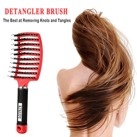 KTKUDY Detangling Brush in a lifestyle setting with a woman brushing her hair