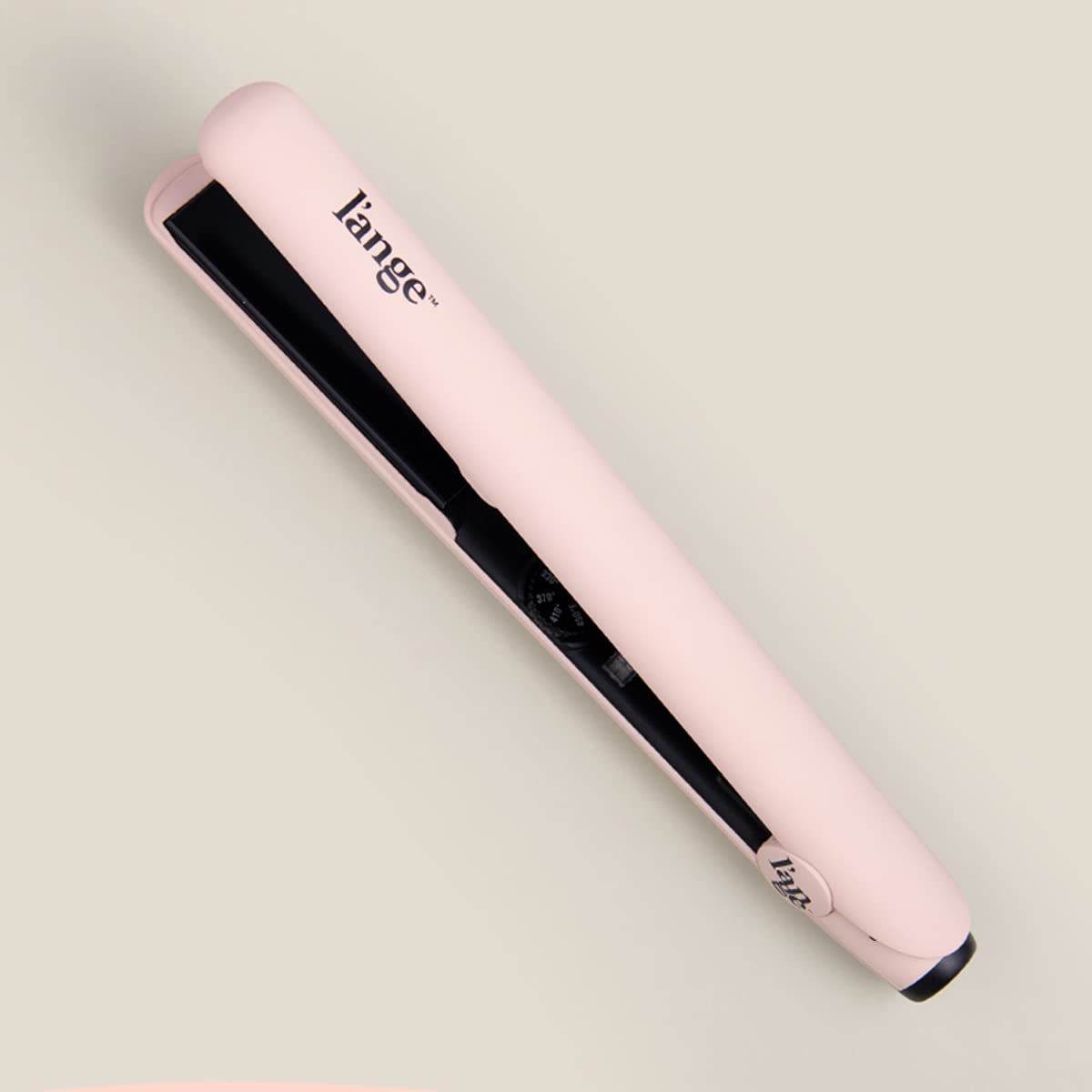 L'ANGE HAIR Le Ceramique Flat Iron on a vanity table