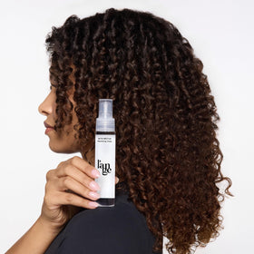 L'ANGE HAIR Satin Néctar Hair Serum on a bathroom counter